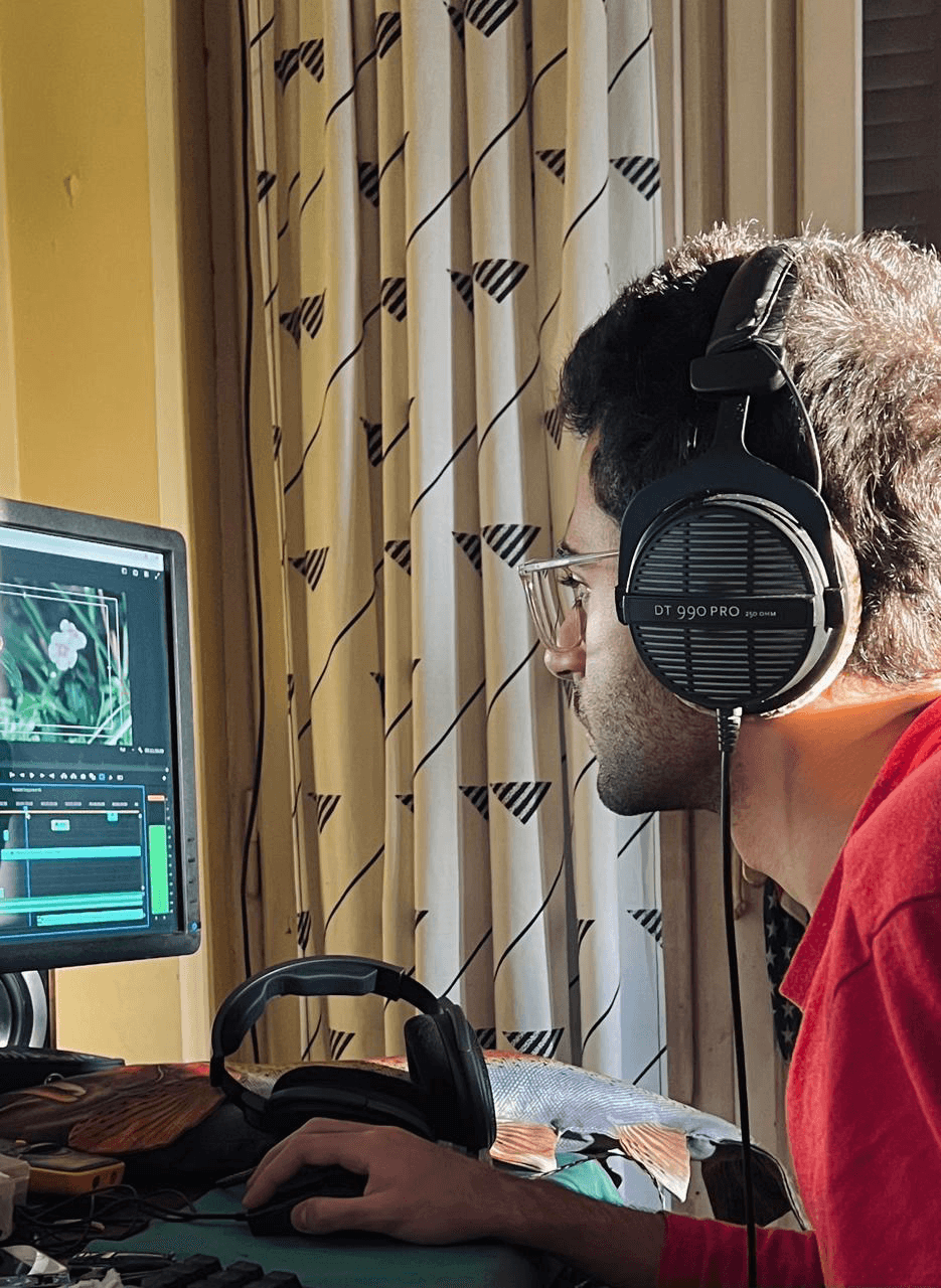 Ali editing with headphones on